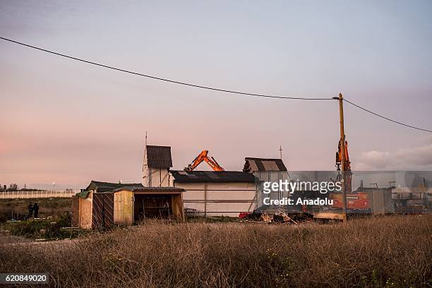 The Eritrean church, last place of worship of the jungle is destroyed by workers and bulldozers, in Calais, on November 3, 2016. Over 350 women and...