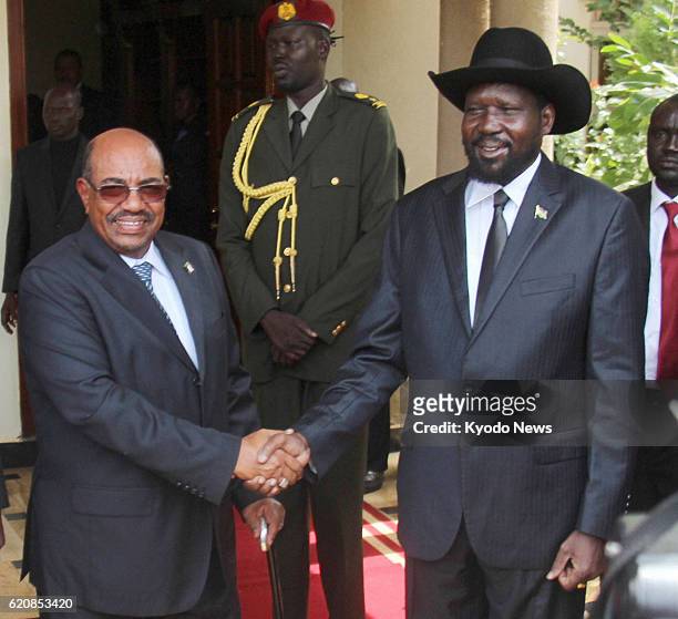 South Sudan - Sudanese President Omar al-Bashir and South Sudanese President Salva Kiir shake hands at Kiir's presidential office in Juba on April...