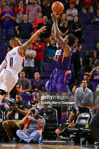 Eric Bledsoe of the Phoenix Suns shoots the game winning three point basket in overtime over Damian Lillard of the Portland Trail Blazers on November...