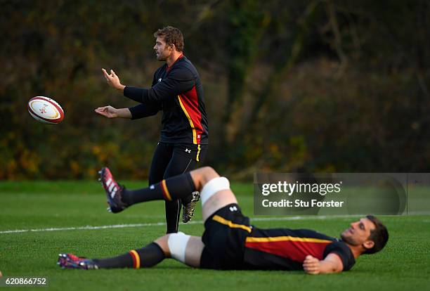 Wales player Leigh Halfpenny in action as Luke Charteris warms up during Wales training in the lead up to the game against Australia at the Vale...