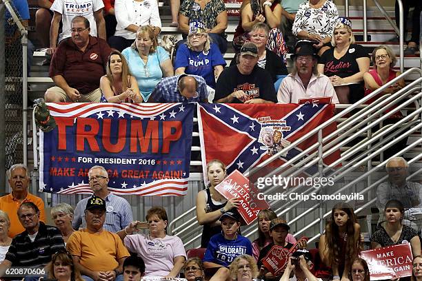 Supporters of Republican presidential nominee Donald Trump listen to him during a campaign rally at the Jacksonville Equestrian Center November 3,...