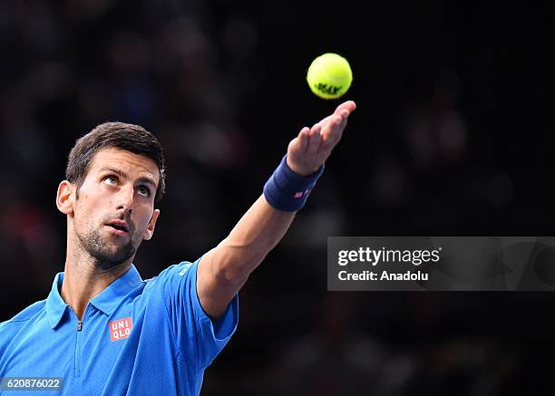 Novak Djokovic of Serbia serves during the Men's second round match against Grigor Dimitrov of Bulgria on day four of the BNP Paribas Masters at...