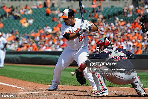 Baltimore Orioles designated hitter Pedro Alvarez in action against Cleveland Indians catcher Roberto Perez at Orioles Park at Camden Yards in...