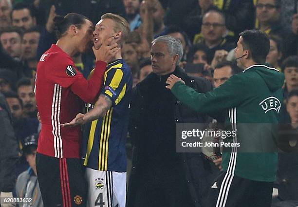 Zlatan Ibrahimovic of Manchester United clashes with Simon Kjaer of Fenerbahce during the UEFA Europa League match between Manchester United and...