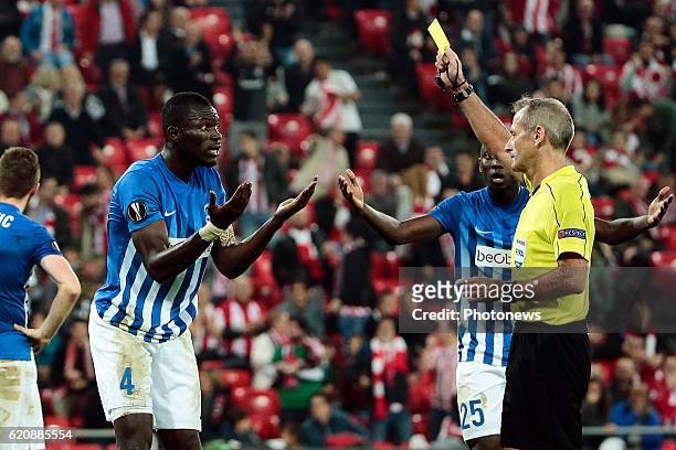 Bilbao, Spain Omar Colley of KRC Genk receives a yellow card from referee Martin Atkinson for making a penalty fault pictured during the UEFA Europa...