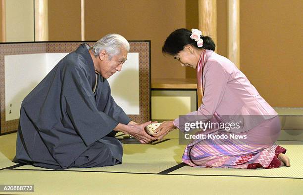 Japan - Myanmar opposition leader Aung San Suu Kyi takes part in a tea ceremony with Sen Genshitsu , former grand master of the Urasenke Japanese tea...