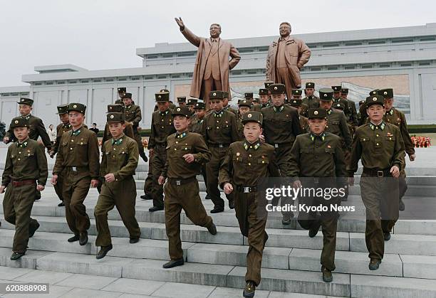 North Korea - Soldiers visit Mansu Hill in Pyongyang, where bronze statues of former North Korean leaders Kim Il Sung and Kim Jong Il stand, on April...