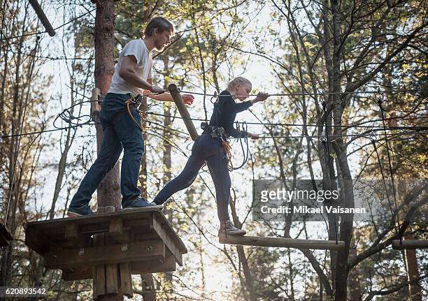 father with daughter on canopy tour - zip line stock pictures, royalty-free photos & images