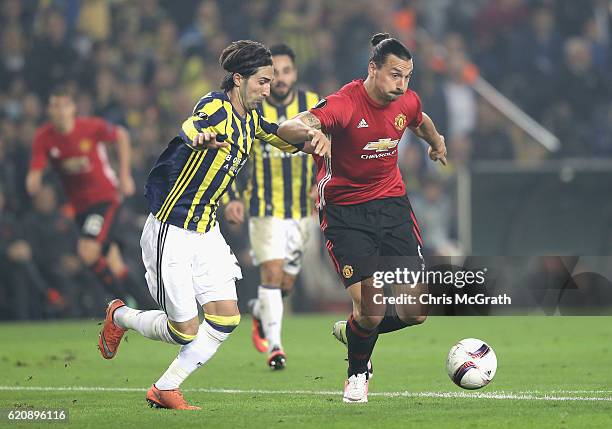 Zlatan Ibrahimovic of Manchester United holds of a tackle from Hasan Ali Kaldirim of Fenerbahce during the UEFA Europa League Group A match between...