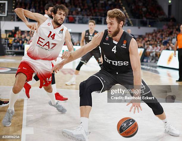 Nicolo Melli, #4 of Brose Bamberg competes with Davide Pascolo, #14 of EA7 Emporio Armani Milan in action during the 2016/2017 Turkish Airlines...