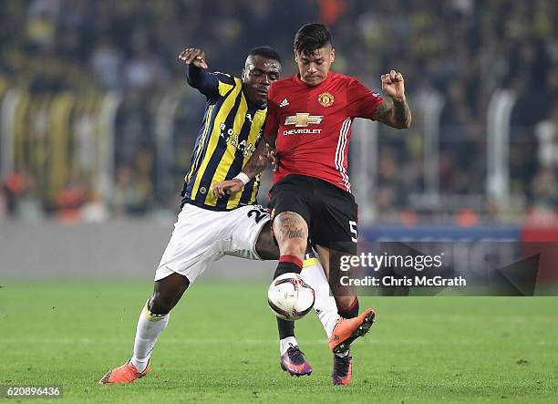 Emmanuel Emenike of Fenerbahce closes down Marcos Rojo of Manchester United during the UEFA Europa League Group A match between Fenerbahce SK and...