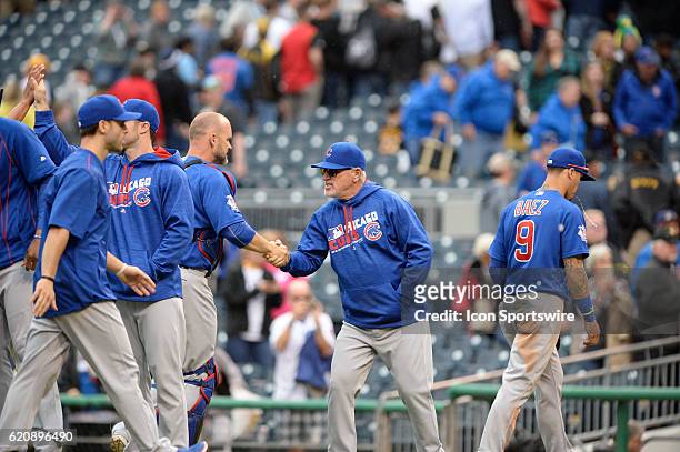 Chicago Cubs Manager Joe Maddon congratulates Chicago Cubs Catcher David Ross [3068] after their 6-2 win against the Pittsburgh Pirates at PNC Park...