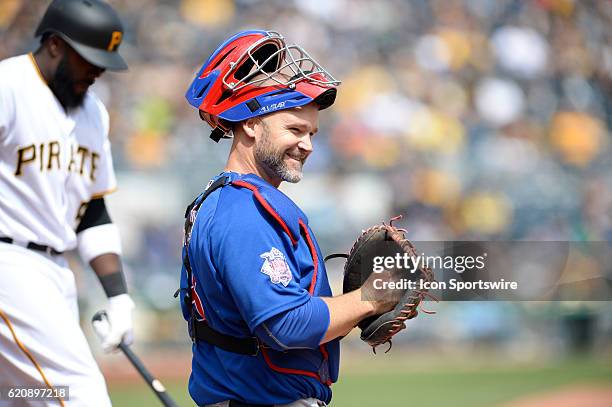 Chicago Cubs catcher David Ross [3068] smiles back to his dugout during the Pittsburgh Pirates 6-2 loss against the Chicago Cubs at PNC Park in...