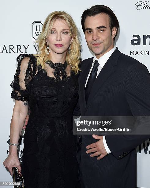 Musician Courtney Love and director Nicholas Jarecki arrive at amfAR's Inspiration Gala Los Angeles at Milk Studios on October 27, 2016 in Hollywood,...