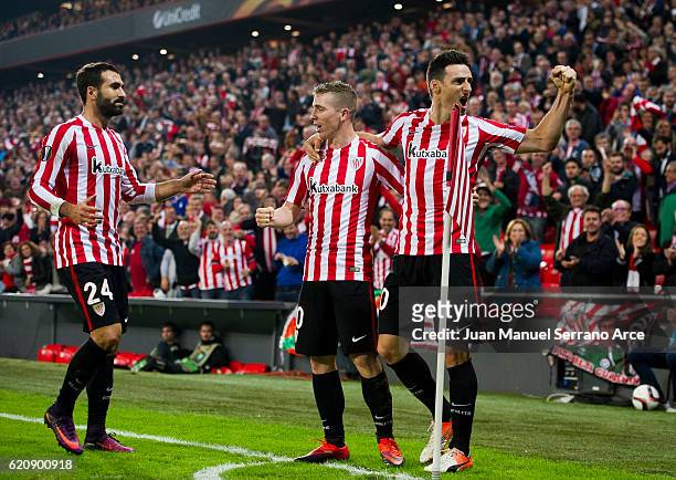 Aritz Aduriz of Athletic Club celebrates with his teammates Iker Muniain of Athletic Club after scoring his team's fourth goal during the UEFA Europa...
