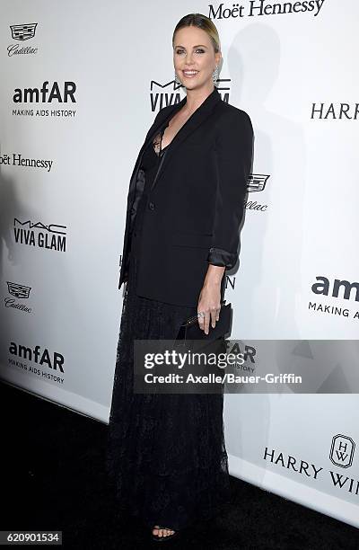 Actress Charlize Theron arrives at amfAR's Inspiration Gala Los Angeles at Milk Studios on October 27, 2016 in Hollywood, California.