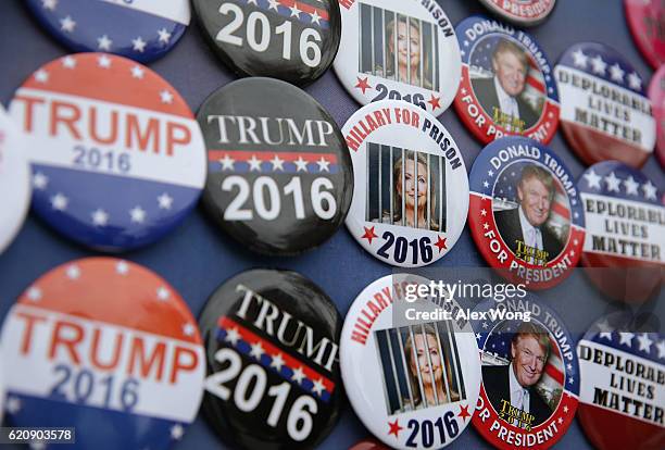 Campaign buttons are seen outside a Trump campaign event November 3, 2016 in Berwyn, Pennsylvania. Melania Trump, wife of Republican presidential...