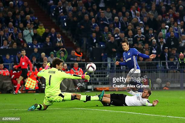 Yevhen Konoplyanka of FC Schalke 04 attempts to lift the ball over Stanislav Kritsyuk and Dmitri Torbinski of FC Krasnodar during the UEFA Europa...