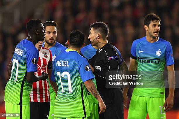 Internazional players surround the referee after a penalty is awarded to Southampton during the UEFA Europa League Group K match between Southampton...