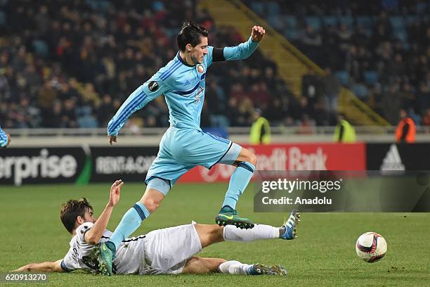 Ihor Kharatin of FC Zorya Luhansk competes for the ball with Marko Vejinovic of Feyenoord during the UEFA Europa League group A match between FC...