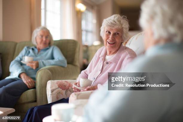 older caucasian women talking in nursing home - retirement village stock pictures, royalty-free photos & images