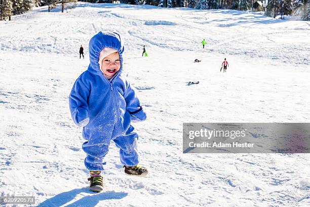 caucasian girl playing in snow - winter baby stock pictures, royalty-free photos & images