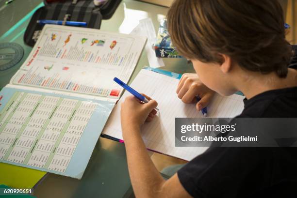 caucasian boy doing homework - spelling fotografías e imágenes de stock