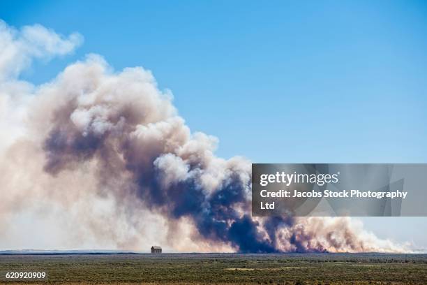 smoke billowing from farmland fire - distant fire stock pictures, royalty-free photos & images