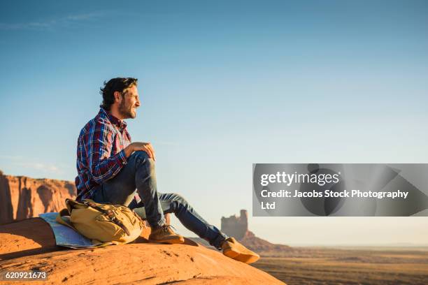 hispanic man admiring view in remote desert - utah scenics stock pictures, royalty-free photos & images