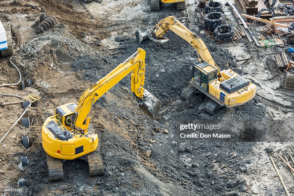 Aerial view of diggers at construction site