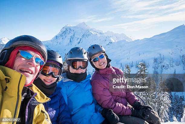 family riding ski lift - family fun snow stock pictures, royalty-free photos & images