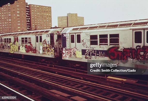 Subway car marked with extensive graffiti tags passes through a station, New York City, New York, May, 1973. Image courtesy National Archives. .