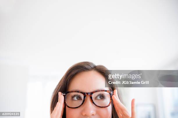 mixed race woman wearing eyeglasses - asian ceiling fotografías e imágenes de stock