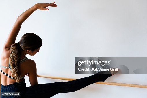 Mixed race dancer practicing in studio Mixed race dancer practicing in studio