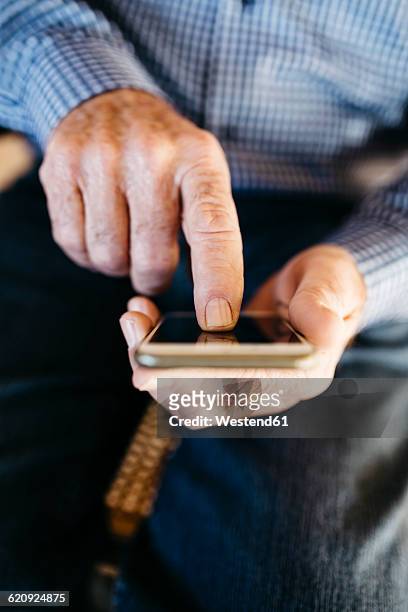 hands of senior man using smartphone - index finger stock pictures, royalty-free photos & images