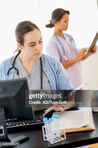 Nurses Medical Chart Nurse Reading Medical Chart In Hospital High-Res Stock Photo - Getty Images