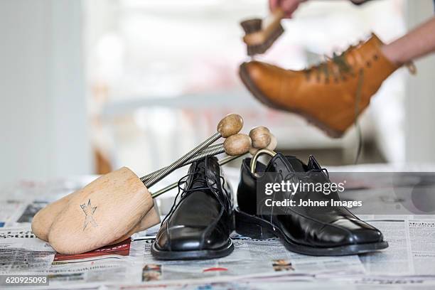 person polishing shoes - polishing shoes stock pictures, royalty-free photos & images
