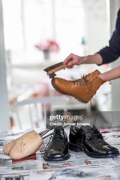 person polishing shoes - 靴をみがく ストックフォトと画像