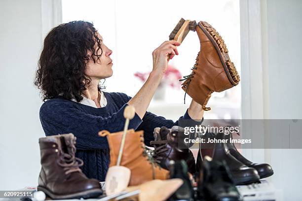 woman - polishing shoes stock pictures, royalty-free photos & images