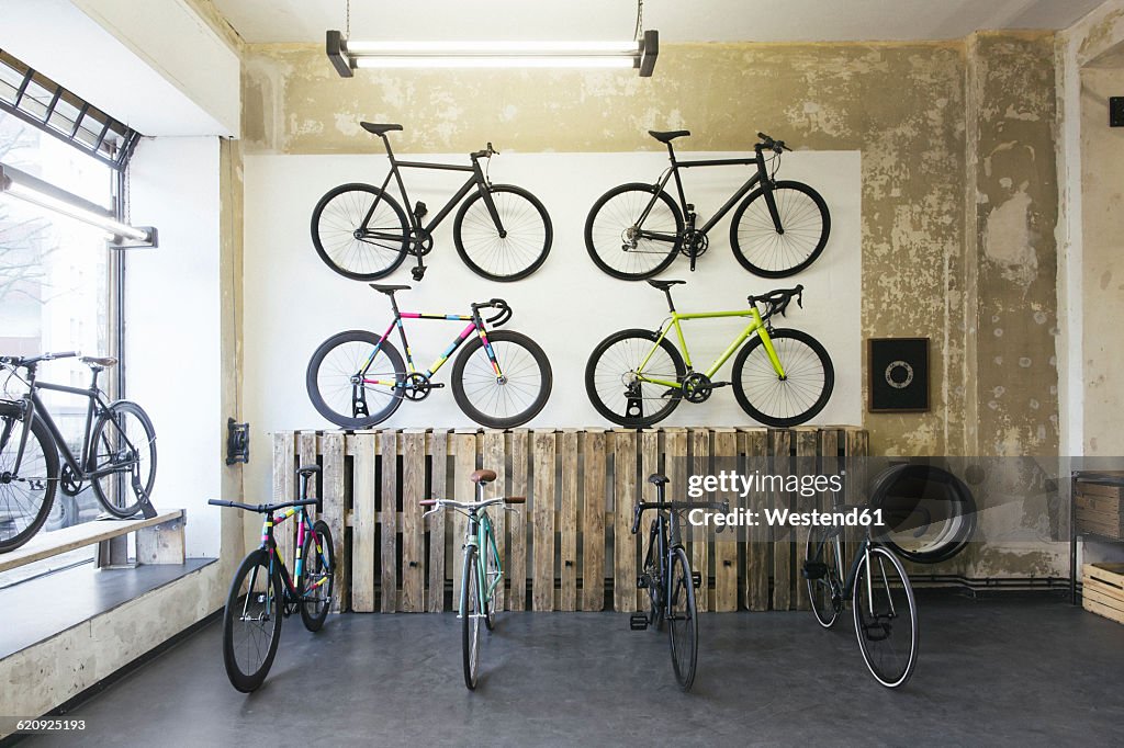 Assortment of racing cycles in a custom-made bicycle store