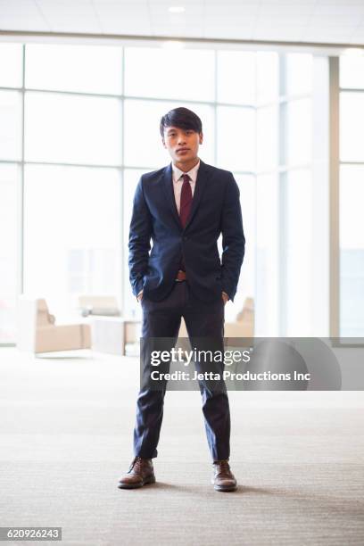 serious vietnamese businessman in office - vietnamese ethnicity stock pictures, royalty-free photos & images