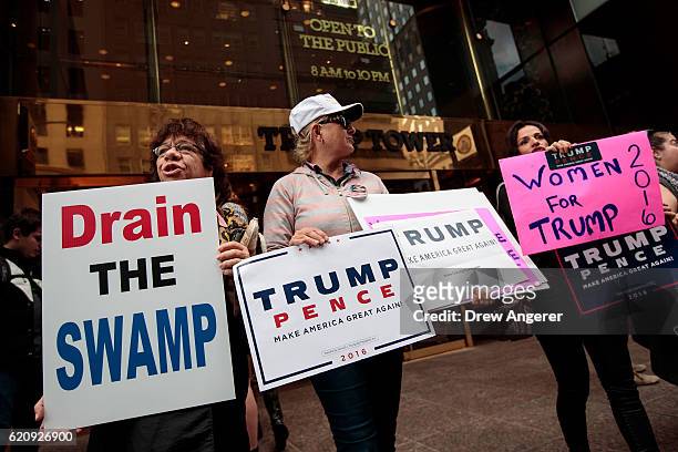 Supporters of Republican presidential candidate Donald Trump stand outside of Trump Tower, November 3, 2016 in New York City. Election Day is less...
