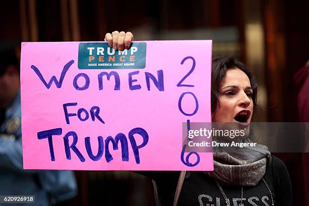 Supporter of Republican presidential candidate Donald Trump stands outside of Trump Tower, November 3, 2016 in New York City. Election Day is less...