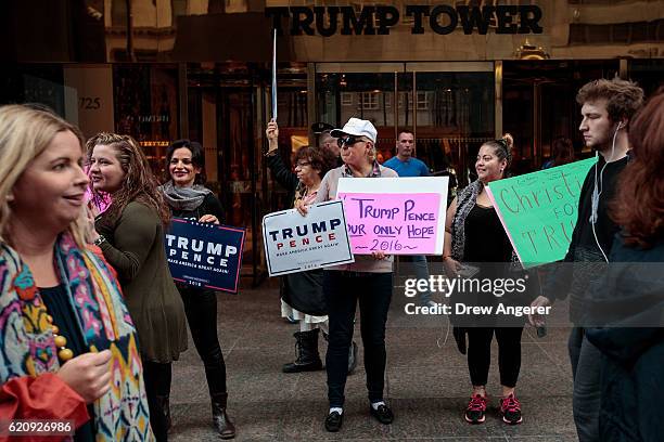 Supporters of Republican presidential candidate Donald Trump stand outside of Trump Tower, November 3, 2016 in New York City. Election Day is less...