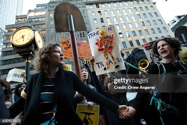 Group of protestors, comprised mostly of women, rally against Republican presidential candidate Donald Trump outside of Trump Tower, November 3, 2016...