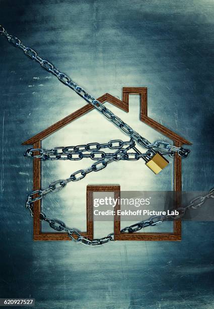 house shape locked in chains - terrorist financing stock pictures, royalty-free photos & images