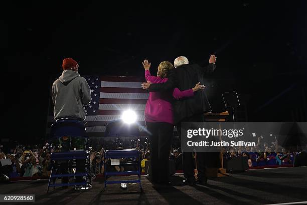 Recording artist Pharrell Williams, Democratic presidential nominee Hillary Clinton and U.S. Sen Bernie Sanders greet supporters during a campaign...