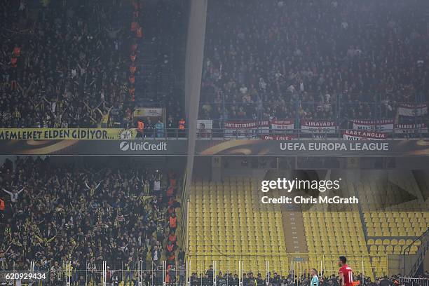 Police secure the area below a stand of Manchester United supporters separated from the Fenerbahce supporters during the UEFA Europa League Group A...
