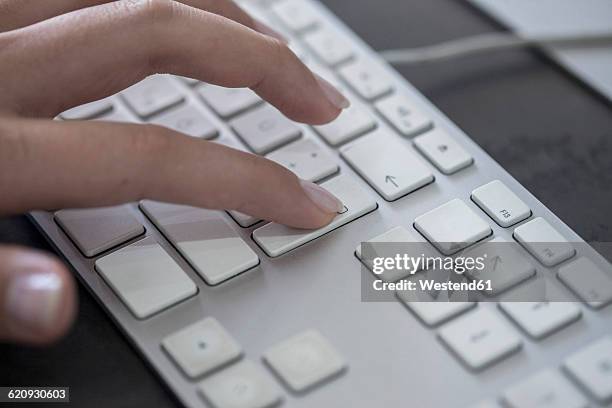 close-up of woman working on computer - enter key stock pictures, royalty-free photos & images