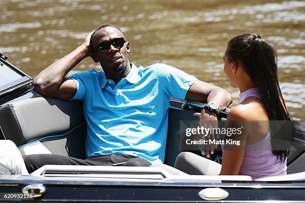 Usain Bolt travels by boat with Australian Olympian Morgan Mitchell to the launch of Nitro Athletics on November 4, 2016 in Melbourne, Australia.